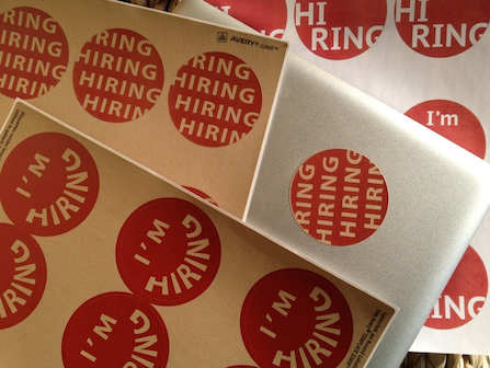 Printed sheets of red ‘I’m hiring’ stickers.